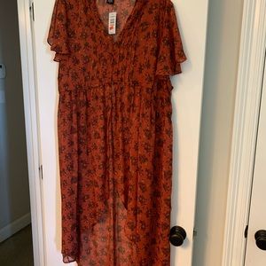 Torrid hi-lo tunic with button- front.